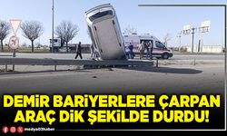 Demir bariyerlere çarpan araç dik şekilde durdu!