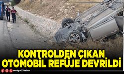 Kontrolden çıkan otomobil refüje devrildi