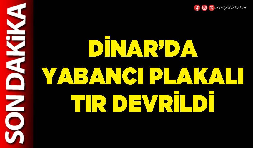 Dinar’da yabancı plakalı tır devrildi